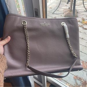 Kate Spade, never used!! New bag, with silver chain hardware. Inside pockets